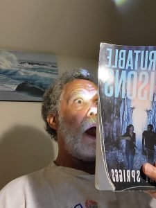 Robert Spriggs holding his book